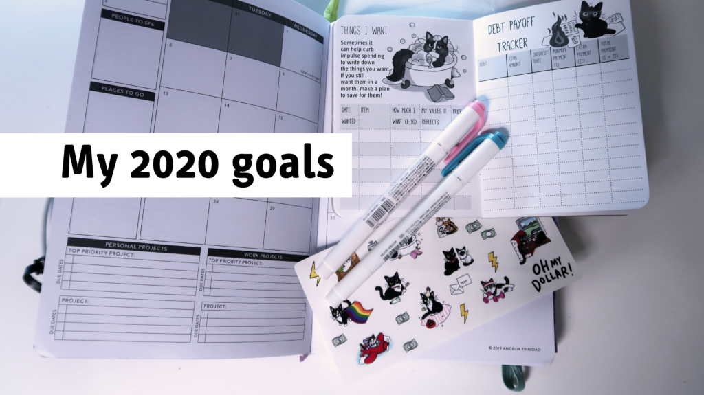 a book and a planner with the text "2020 goals"